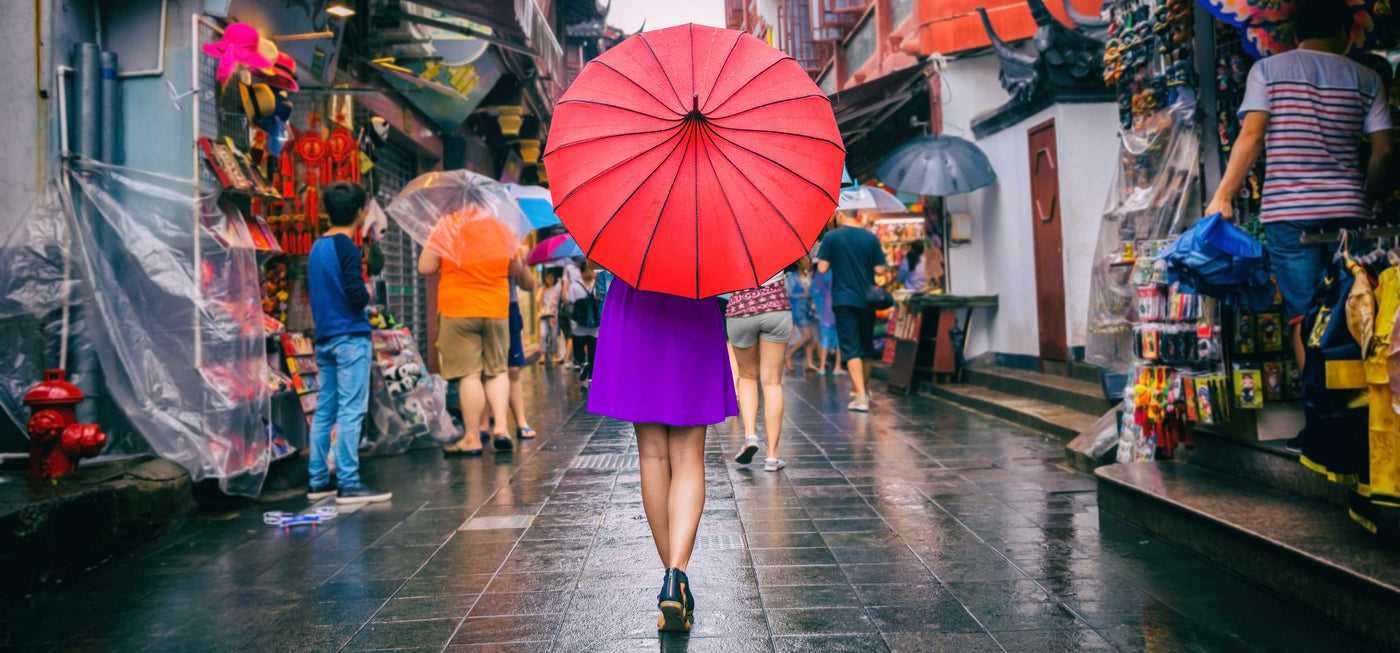 woman in san Francisco china town holding umbrella